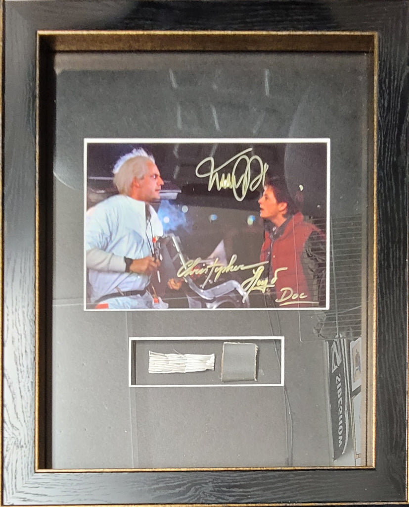 Back to the Future Delorean Parts signed by Michael J. Fox and Christopher LLoyd.